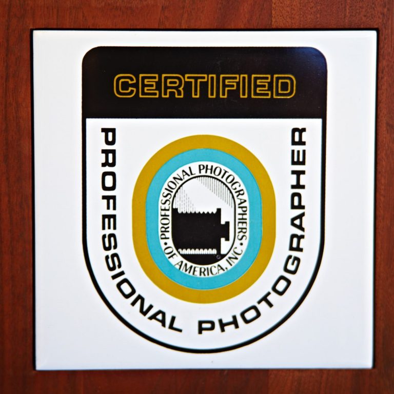 Badge featuring "Certified Professional Photographer" with a camera graphic.